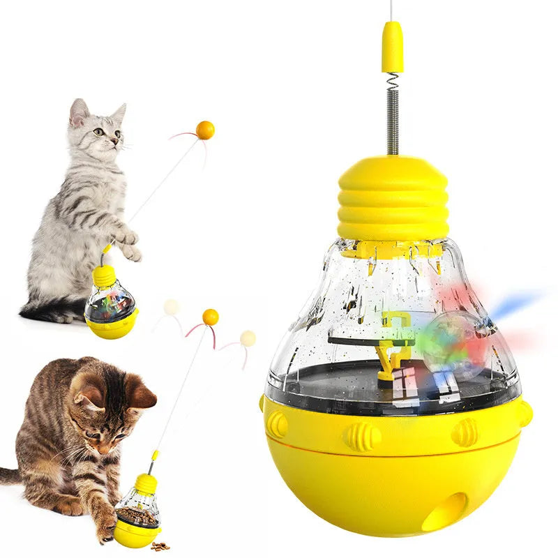 Interactive cat toy with yellow ball teaser and slow food dispenser in rocking base