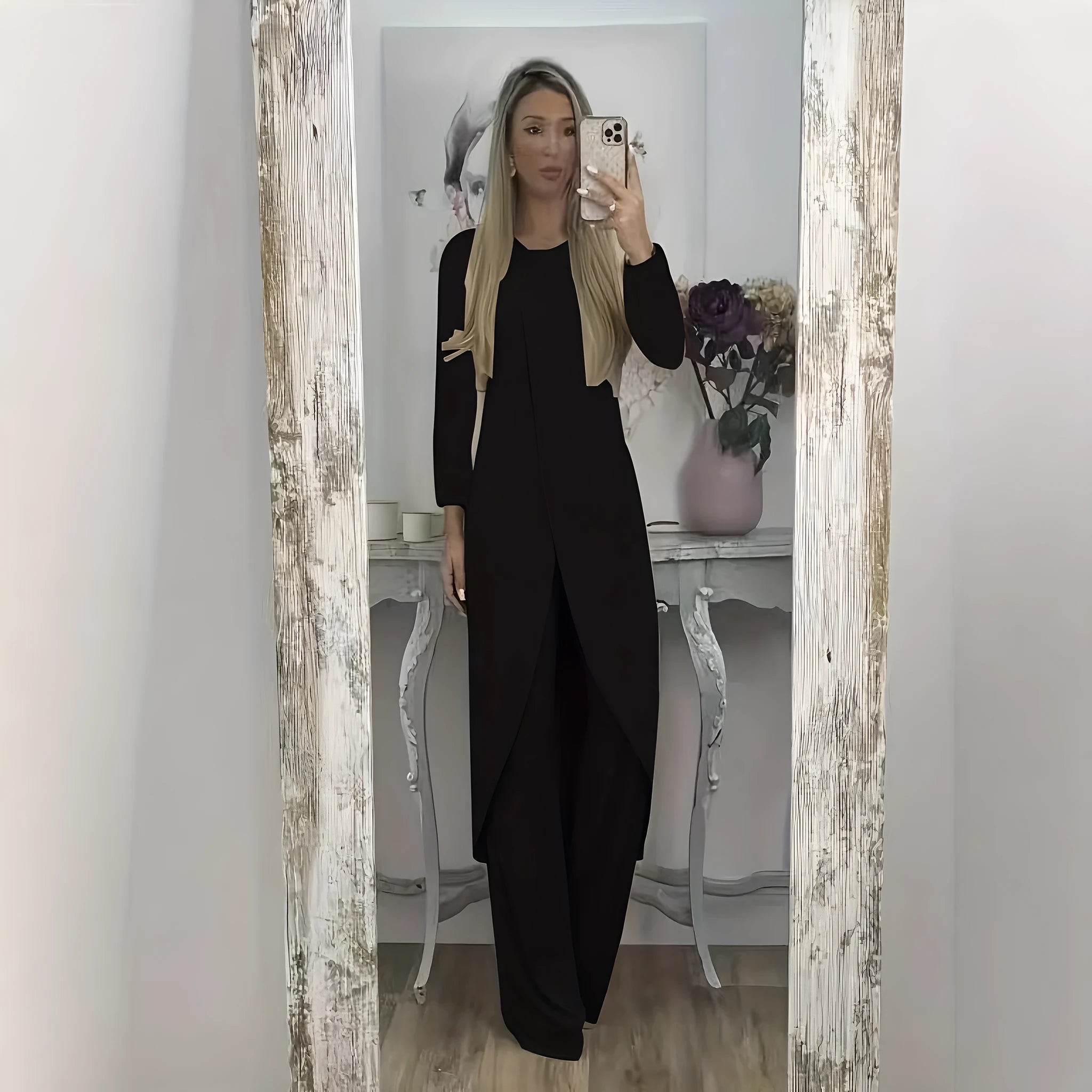 Women's black casual two-piece lounge set with long sleeves and matching trousers on a hanger