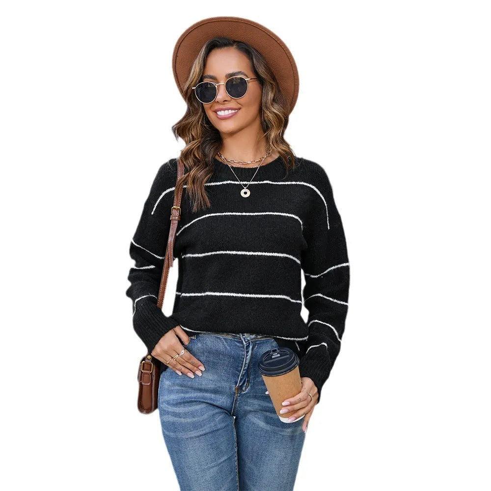 Women's black and white striped loose fit pullover sweater with round neck and regular sleeves
