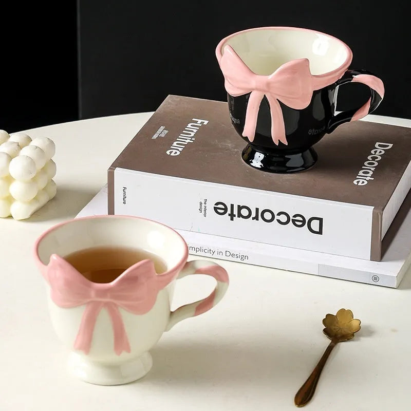 Ceramic mug with heart bow design in black pink or white powder colour, 301-400ml capacity