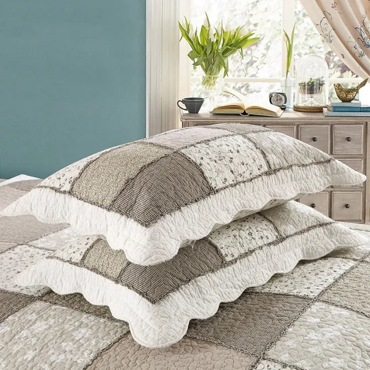 Pure cotton quilted bedspread three-piece set in a chosen pattern, showing the large bed cover and two matching pillowcases.