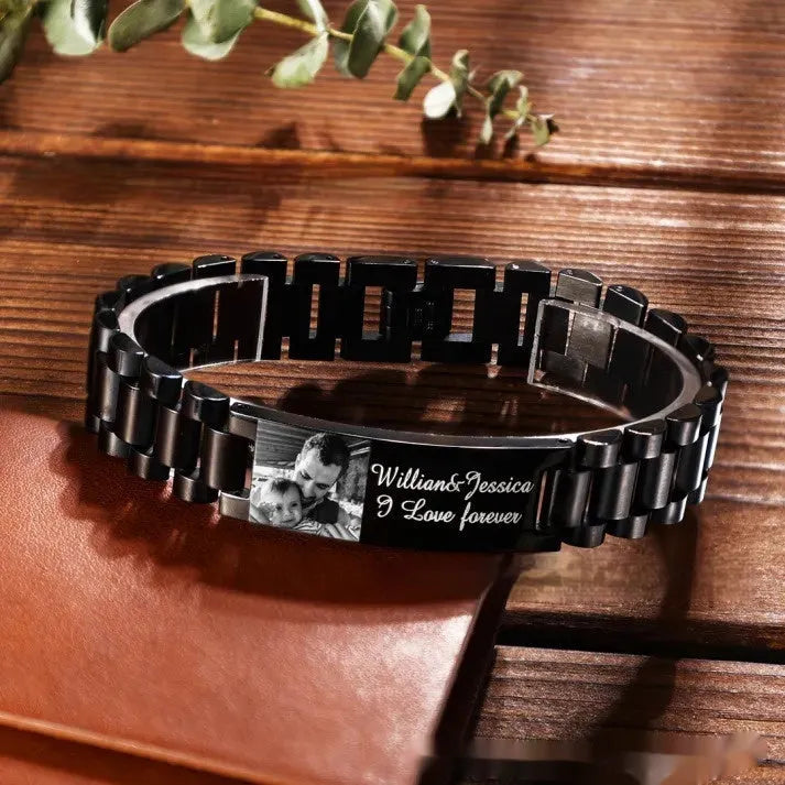 Men's curved heart-shaped stainless steel bracelet with engraved lettering, presented in a gift box.