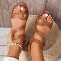 Women's black flat sandals with Velcro strap and round toe design on rubber sole