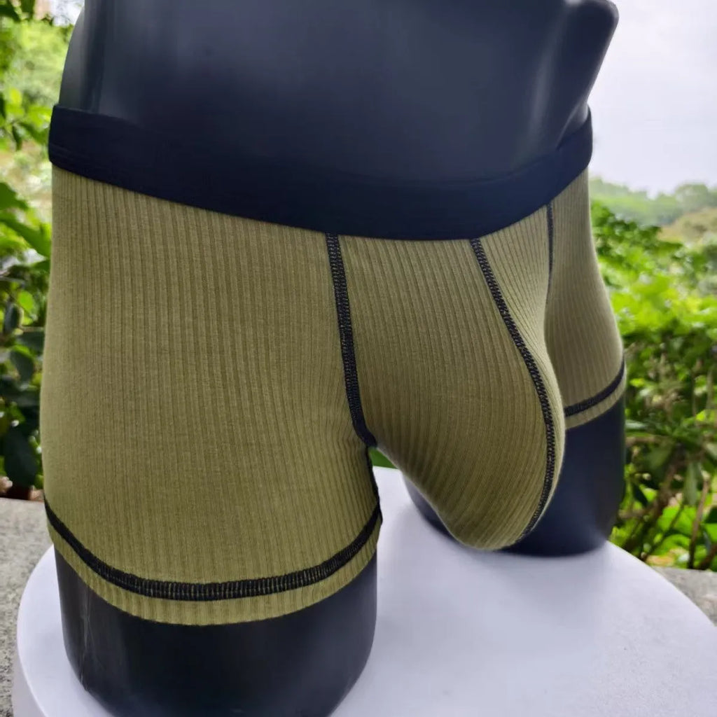 Men's solid colour boxer shorts in breathable fabric on a size chart showing L, XL, 2XL, and 3XL.