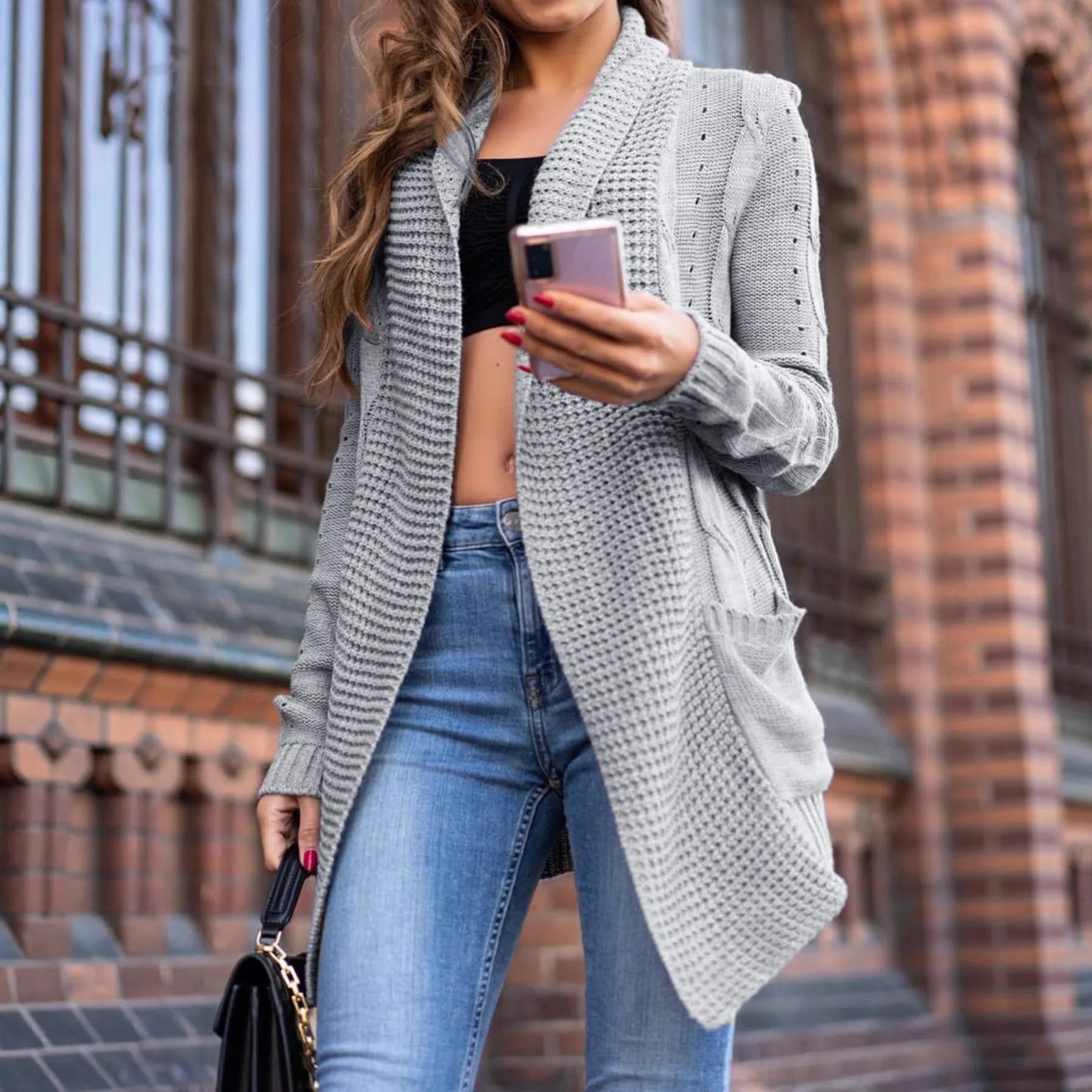 Grey women's loose cardigan coat with front pockets and medium length