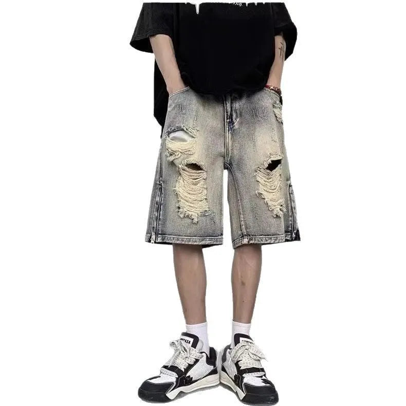 Blue retro-style women's denim shorts with wide leg, loose fit, and tattered detailing on a neutral background.