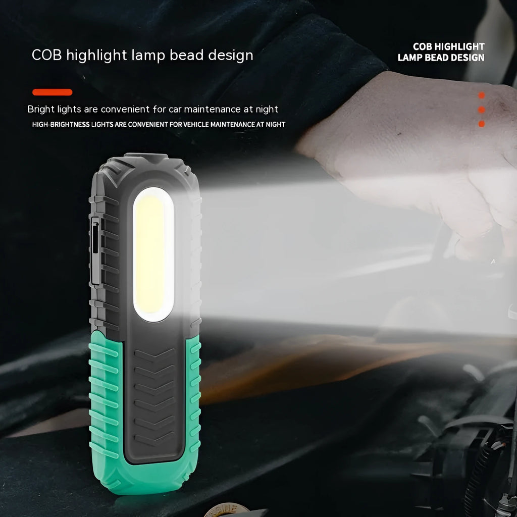 Black and green auto repair work light with USB charging port and drop-resistant coating
