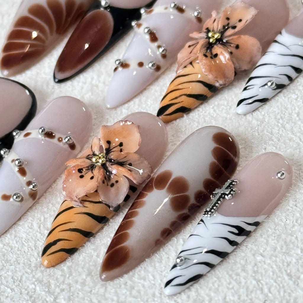 Set of 10 reusable gel nail stickers with French style leopard, cross, and flower print designs.