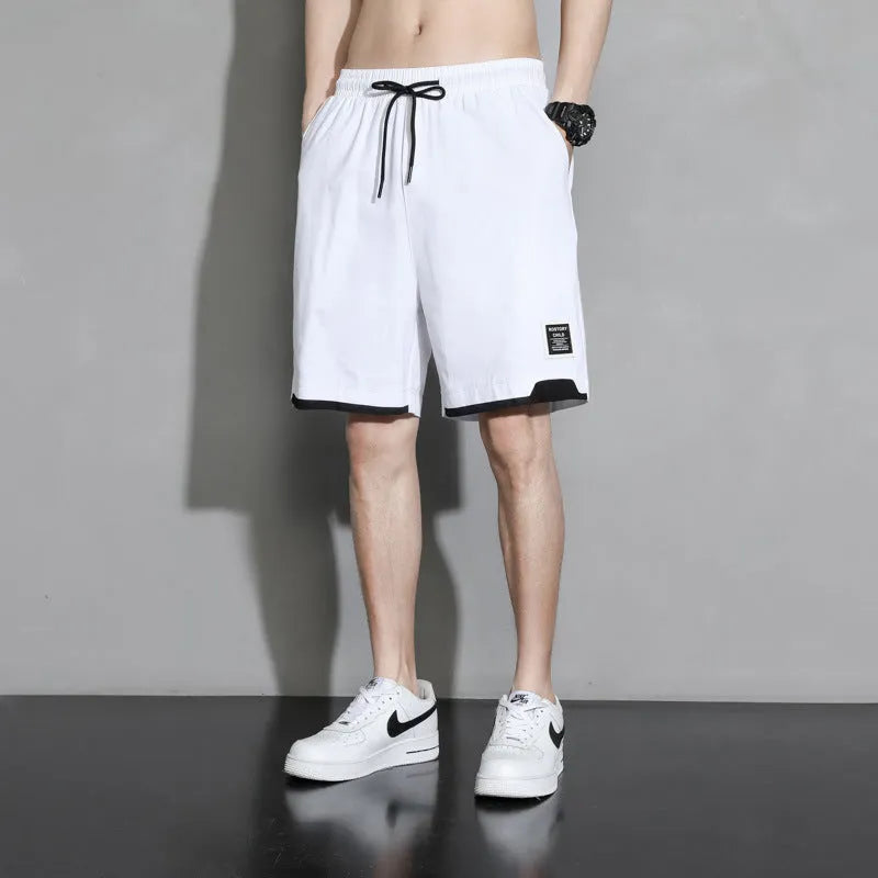 Cotton shorts for boys in black, khaki, or white, showing mid-waist and shorts-length design.