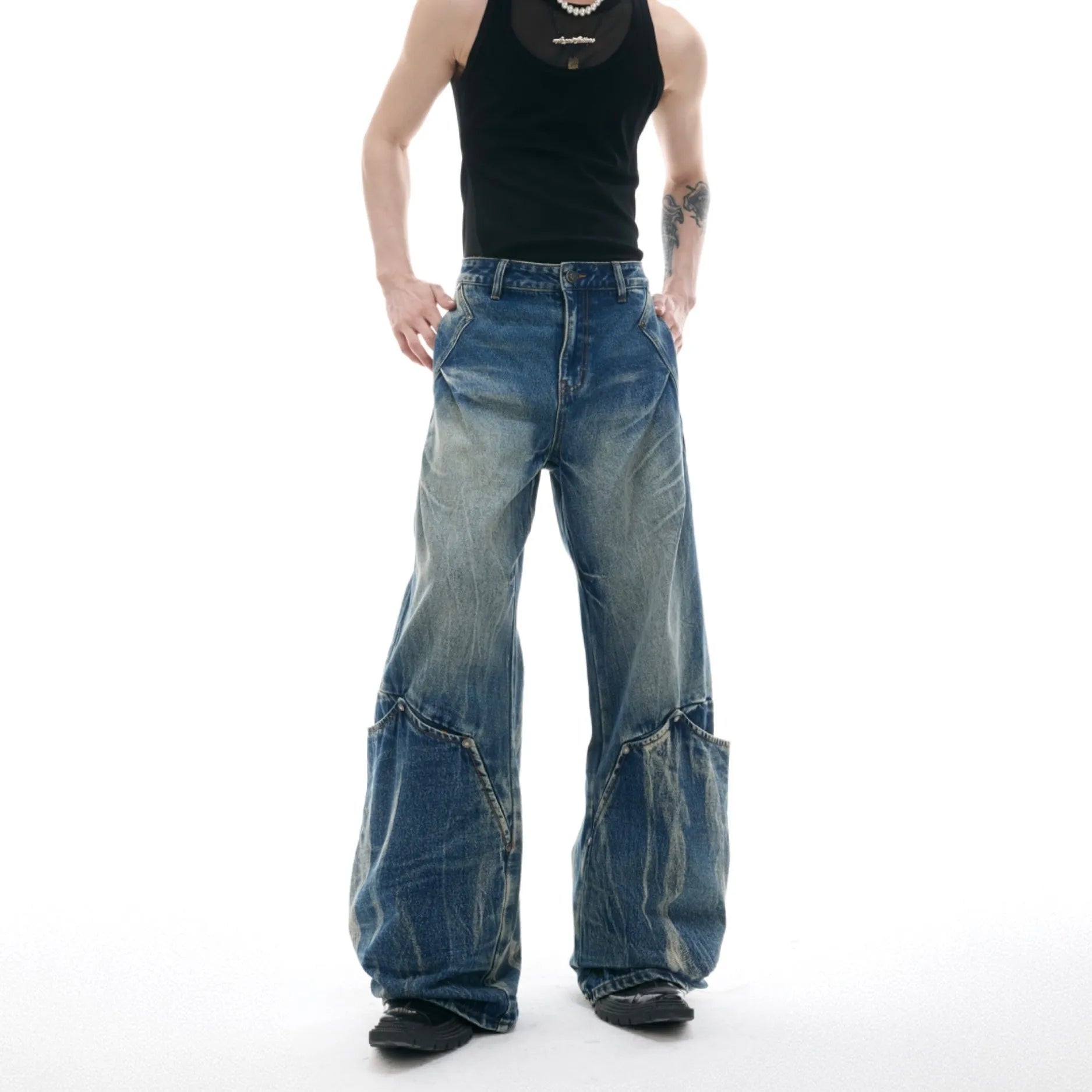 Men's verdant blue retro washed loose fit jeans with burst pattern and curved knife detail.