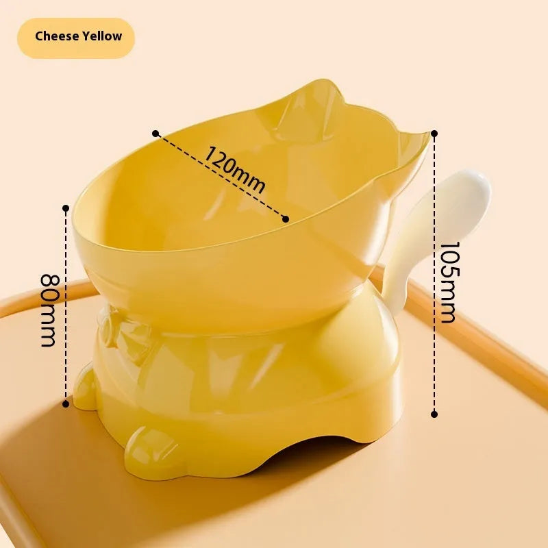 A slanted stainless steel cat bowl in yellow, shown from a side angle on a plain surface.