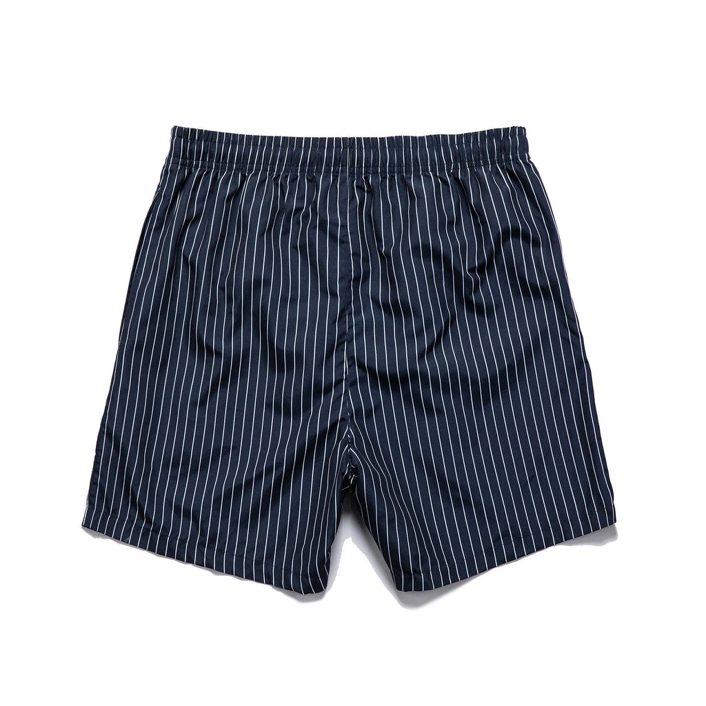 Men's striped beach shorts in navy blue, showing straight leg opening and casual fit.