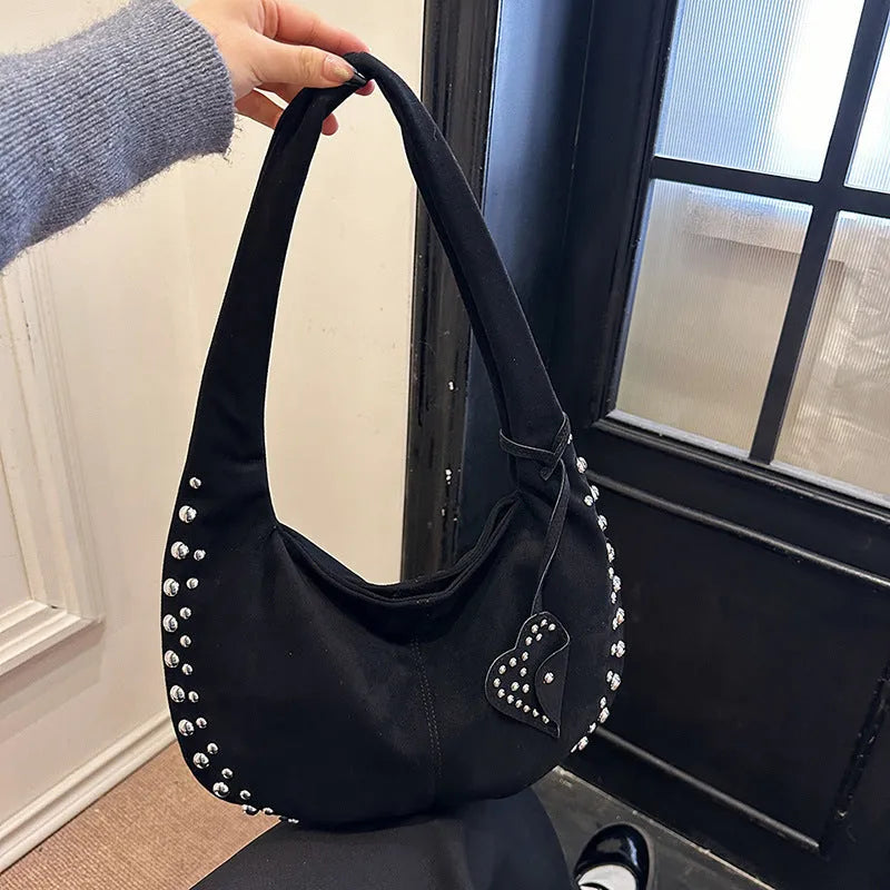 Soft plush casual tote handbag in a retro style, shown in a strapless underarm carry position.