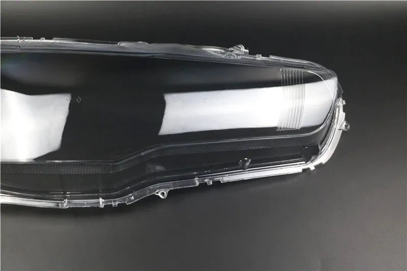 Transparent plastic headlight housing cover for vehicle lamp replacement measuring 50x30x20mm