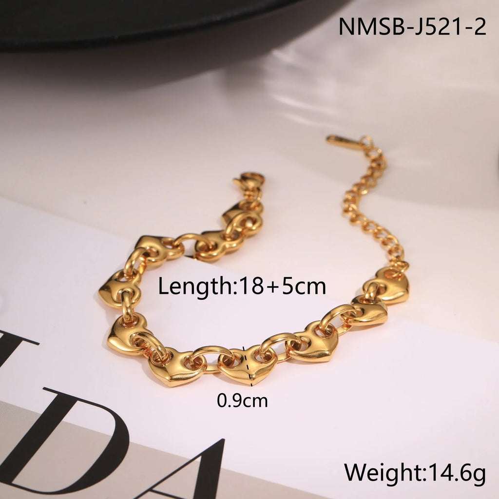 Hollowed-out heart bracelet in stainless steel with gold, steel, or colour-block finish.