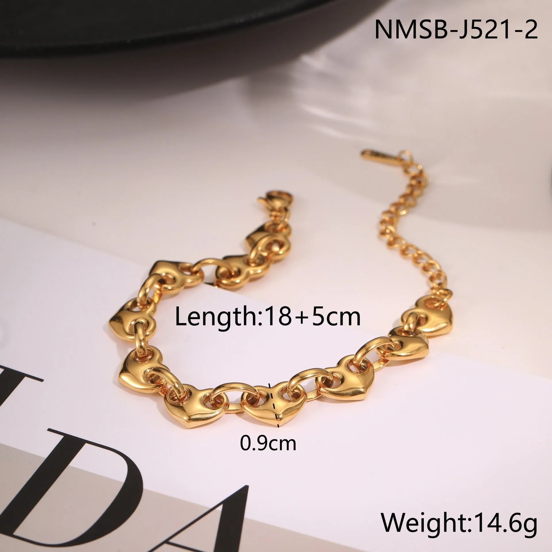 Hollowed-out heart bracelet in stainless steel with gold, steel, or colour-block finish.