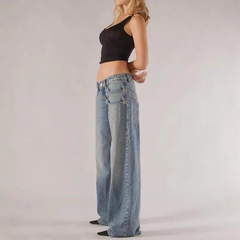Blue loose fit cotton wide leg trousers with low waist and colour splicing detail laid flat.