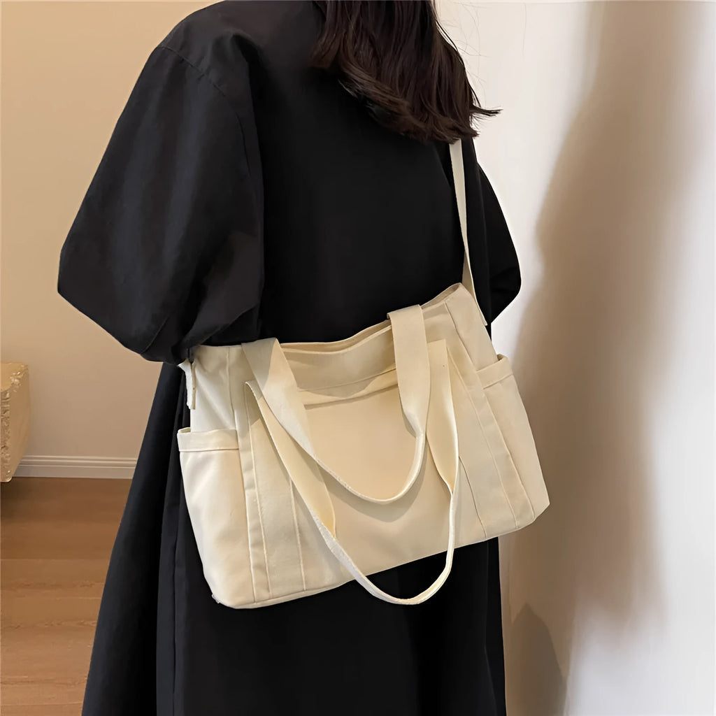 Women's large canvas shoulder tote bag with sandwich pockets and phone compartment in solid colour