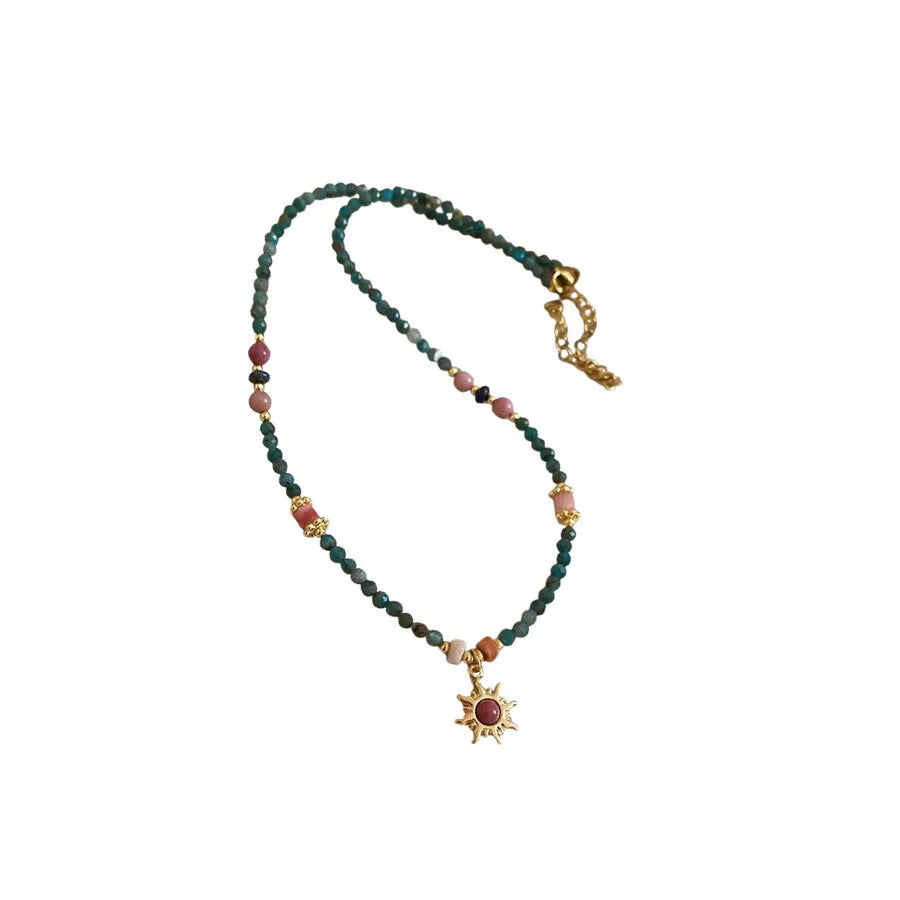 Freshwater pearl necklace with stone sun pendant on clavicle chain
