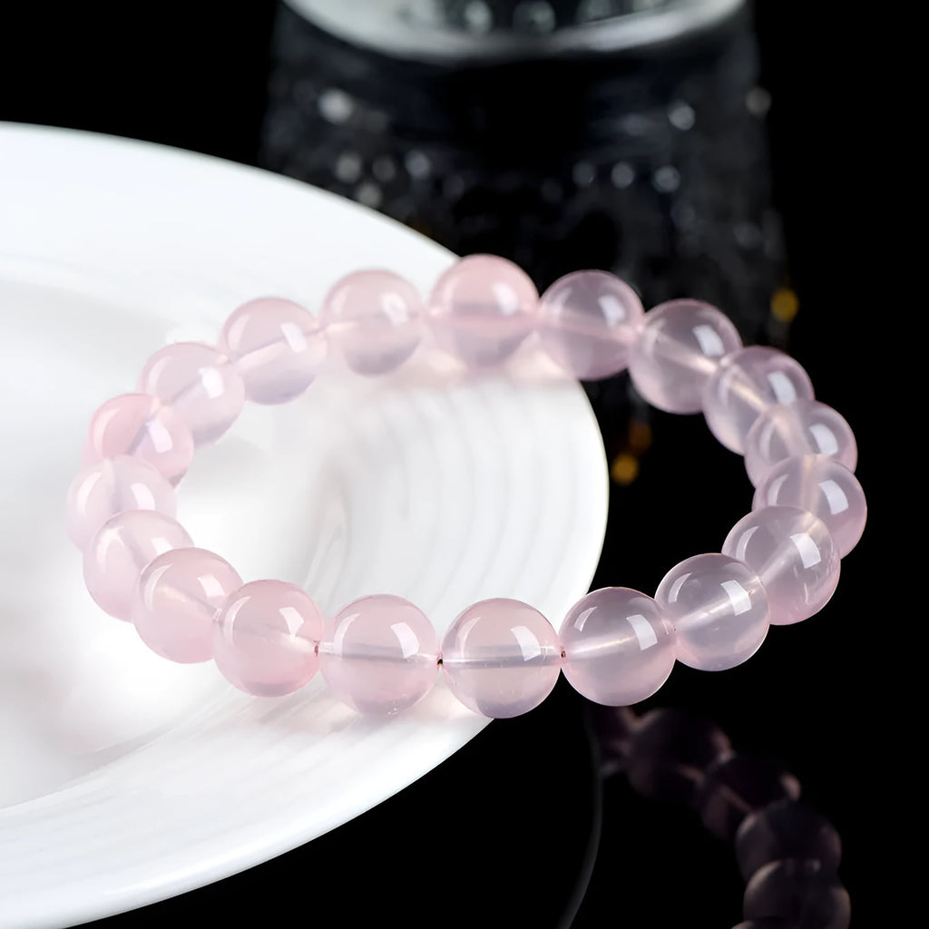 Women's natural starlight crystal bracelet with round pink beads in selectable sizes from 6mm to 22mm.