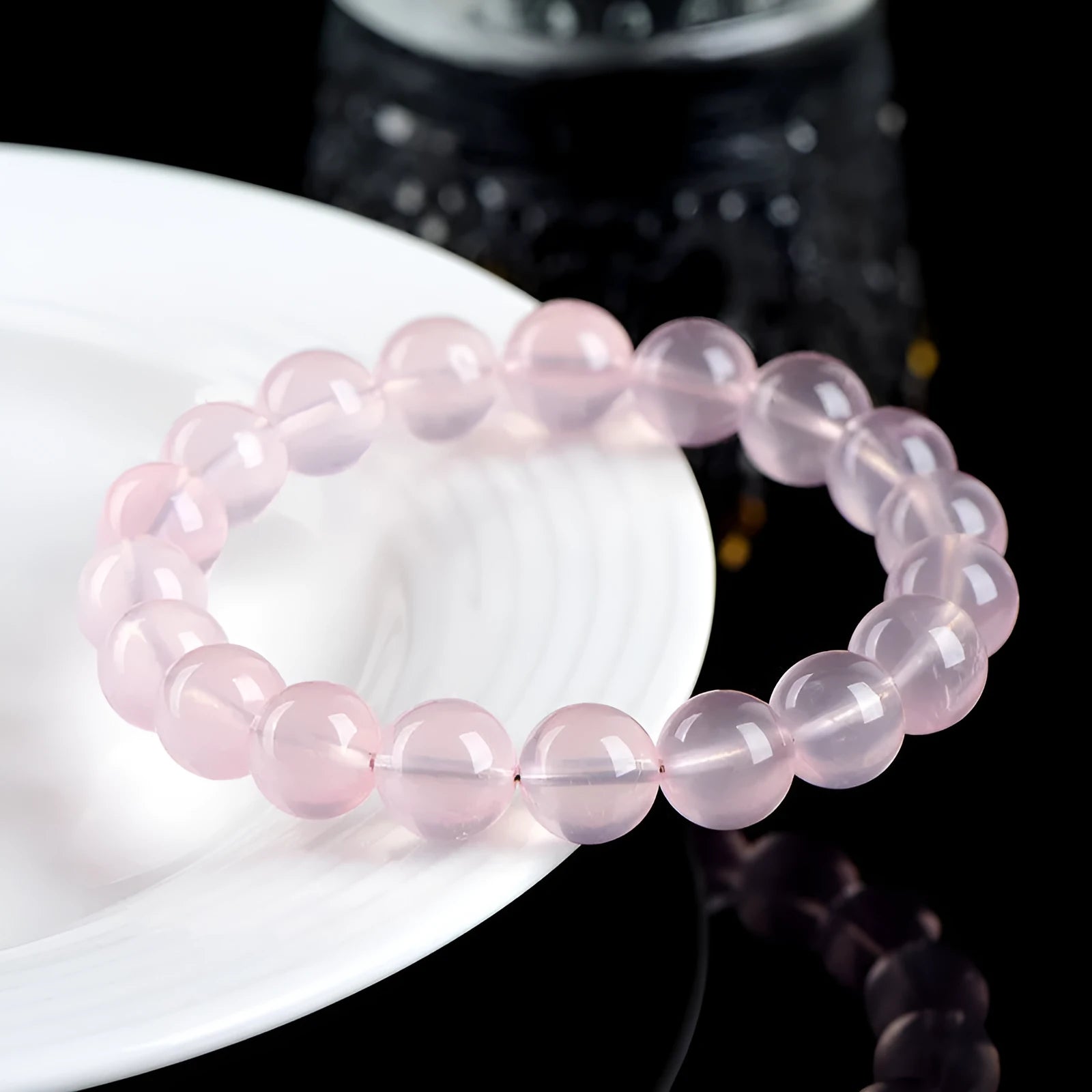 Women's natural starlight crystal bracelet with round pink beads in selectable sizes from 6mm to 22mm.
