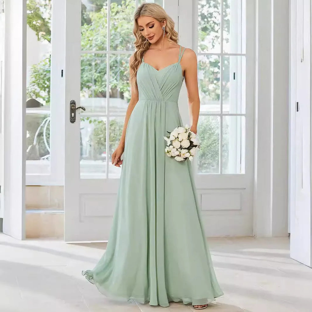 Women's long sling banquet dress with pleating detail in A-line silhouette, available in multiple colours
