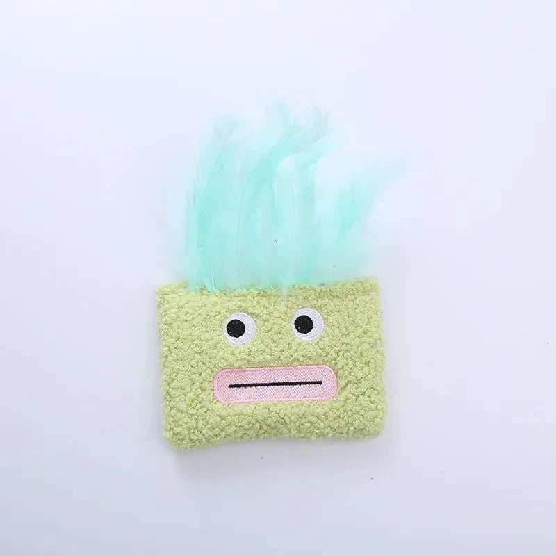 Colourful plush cat toy shaped like an explosion head with a big open mouth, shown in blue.