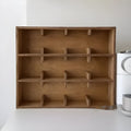 Square birch wood cup storage rack with multiple grid compartments for kitchen organisation