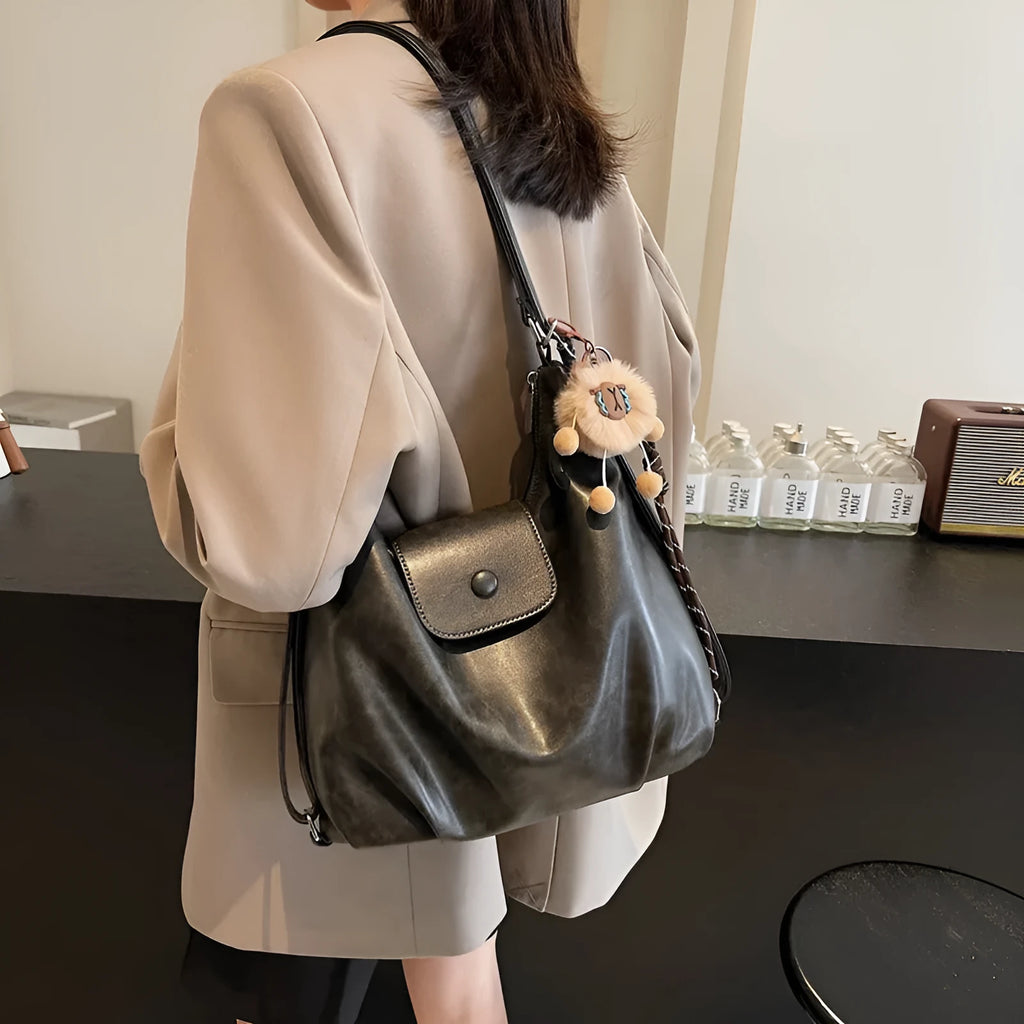 Brown textured PU one-shoulder bag with single strap showing internal phone compartment and horizontal organisation