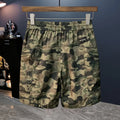 Men's camouflage cargo shorts with cargo pockets and loose fit design