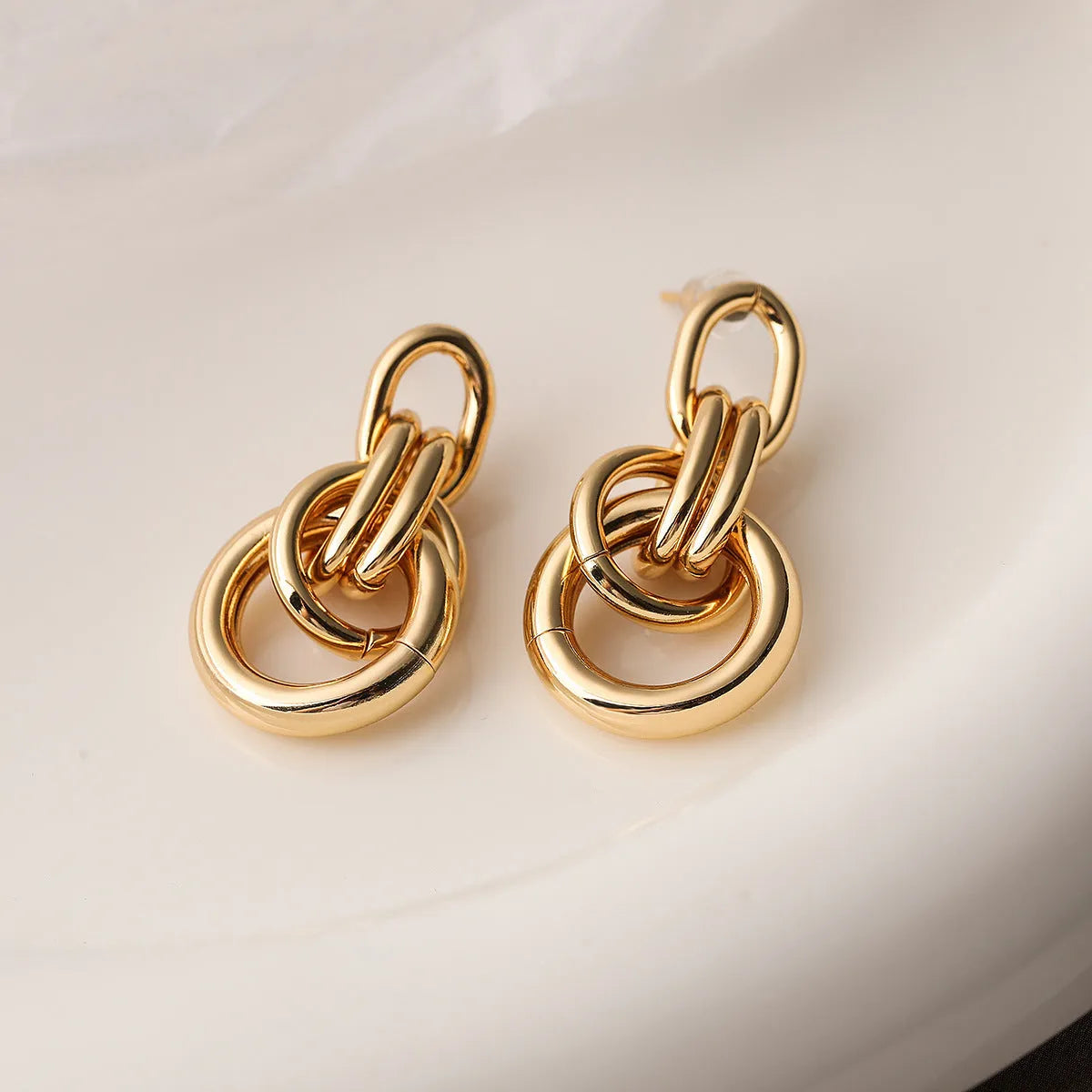 Gold-coloured geometric copper earrings with irregular shape and simple styling for women