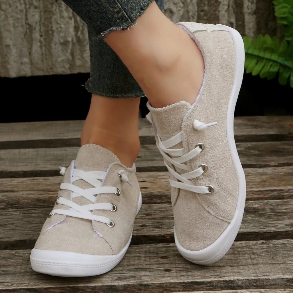 Women's creamy-white fabric casual sneakers with low-top design and rubber soles