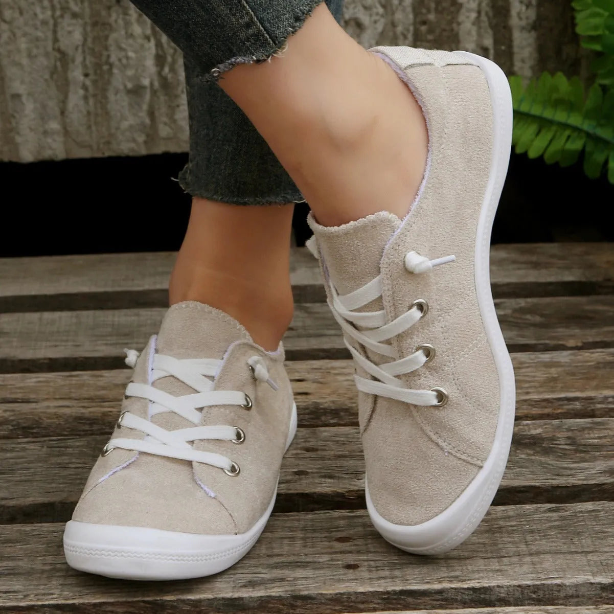 Women's creamy-white fabric casual sneakers with low-top design and rubber soles