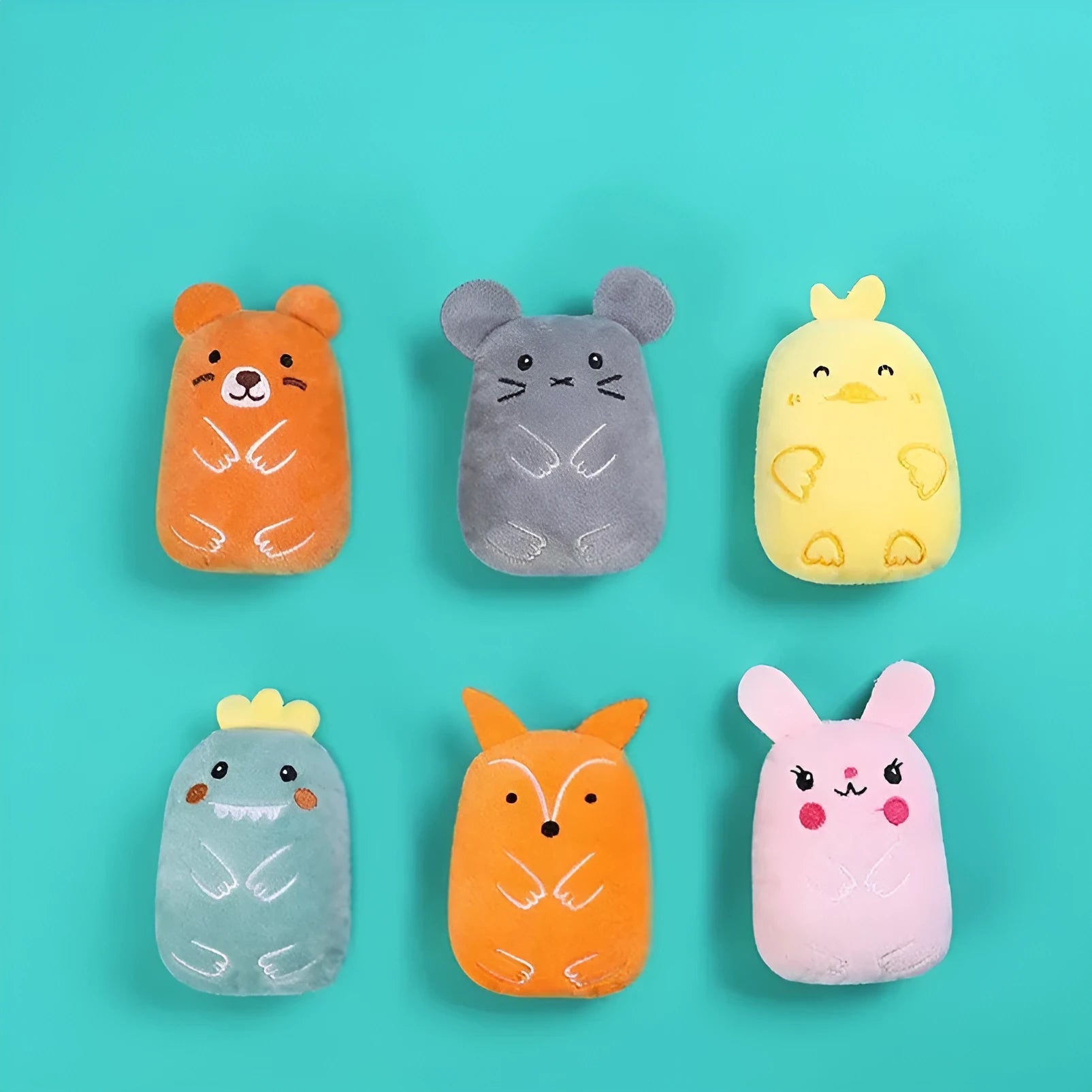 Plush catnip chewing toy for teeth grinding in assorted colours on a white background