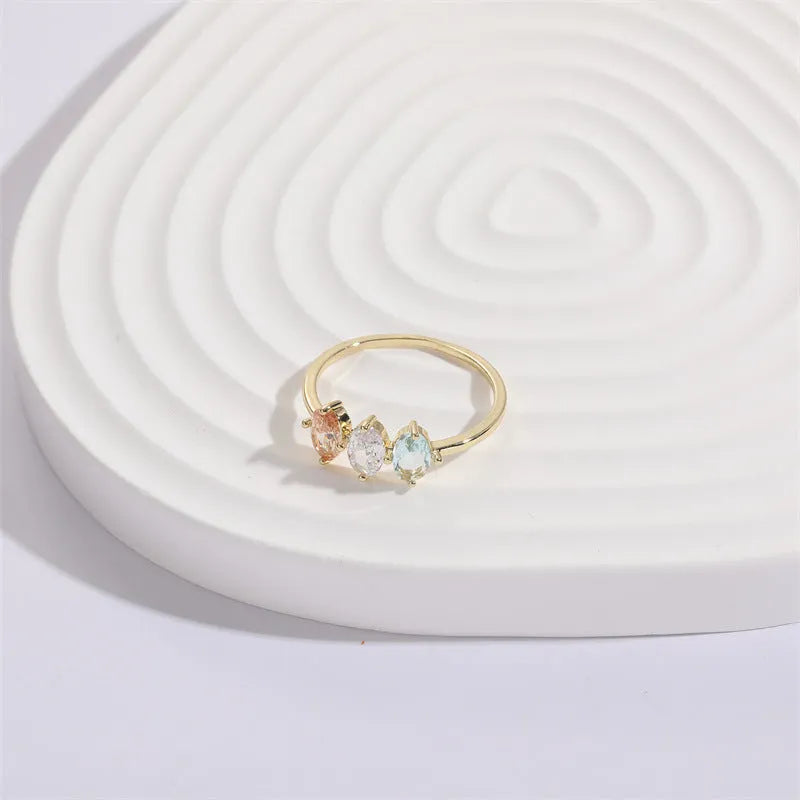 Women's Mother's Day birthstone ring with geometric triangle design and horse eye tricolor zircon stones