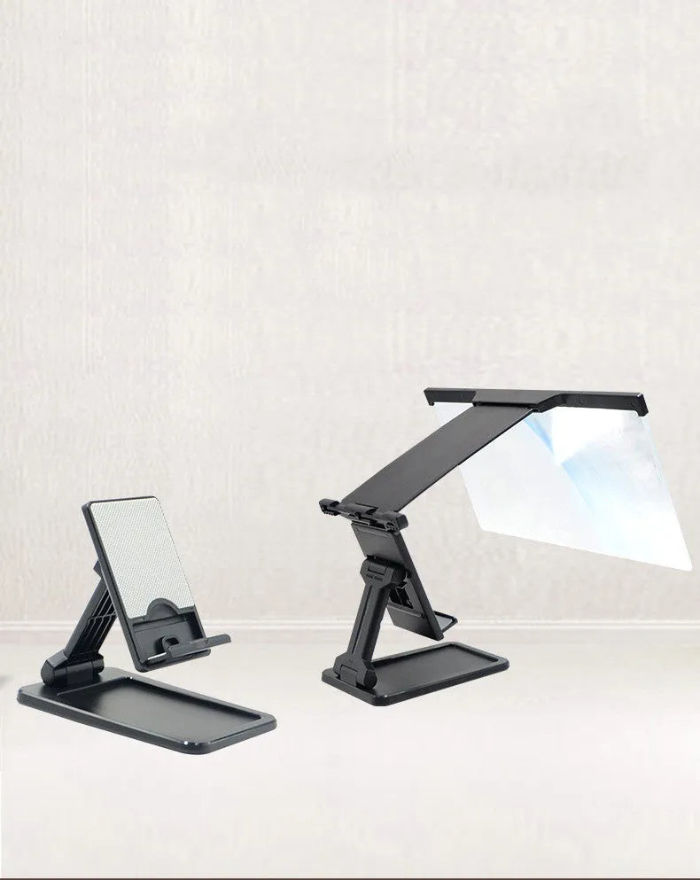 Black folding mobile phone screen amplifier and adjustable holder on a desktop, magnifying a smartphone display.