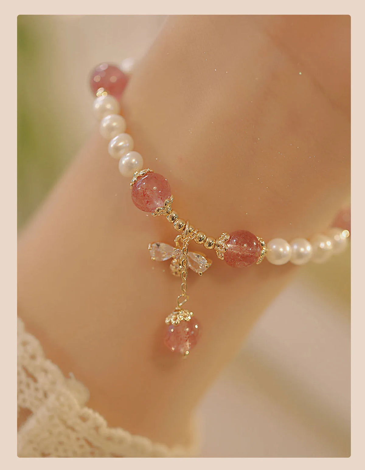 Women's strawberry quartz bracelet with stringed pearls and bow detail in INS style