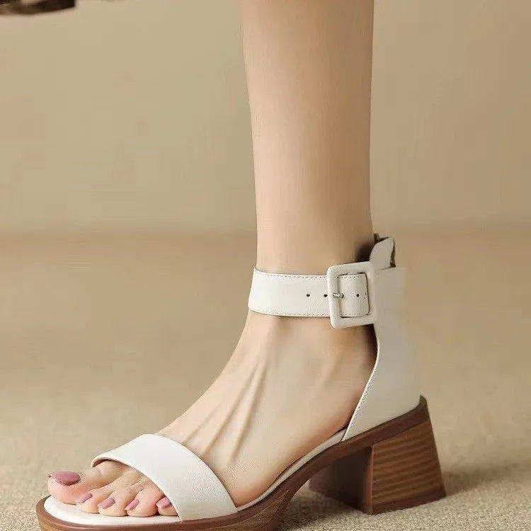 Women's white ankle-strap platform heels with round toe design