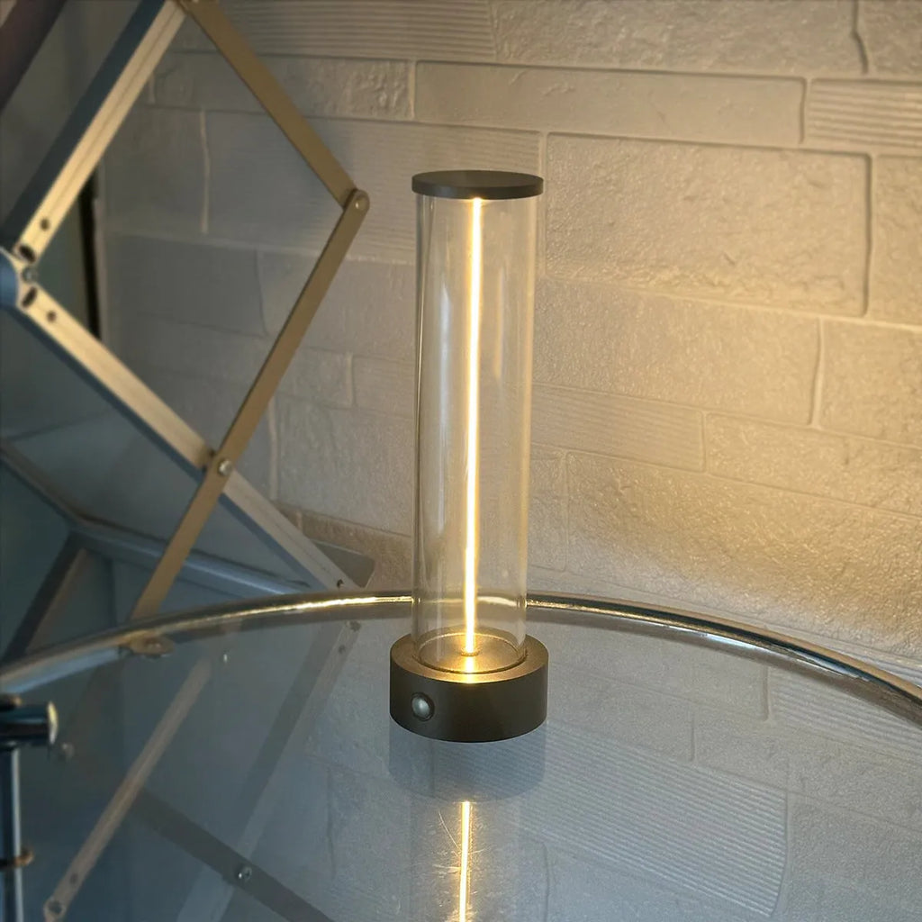 Modern glass LED light strip with magnetic back, measuring 234mm high, on a metal surface.