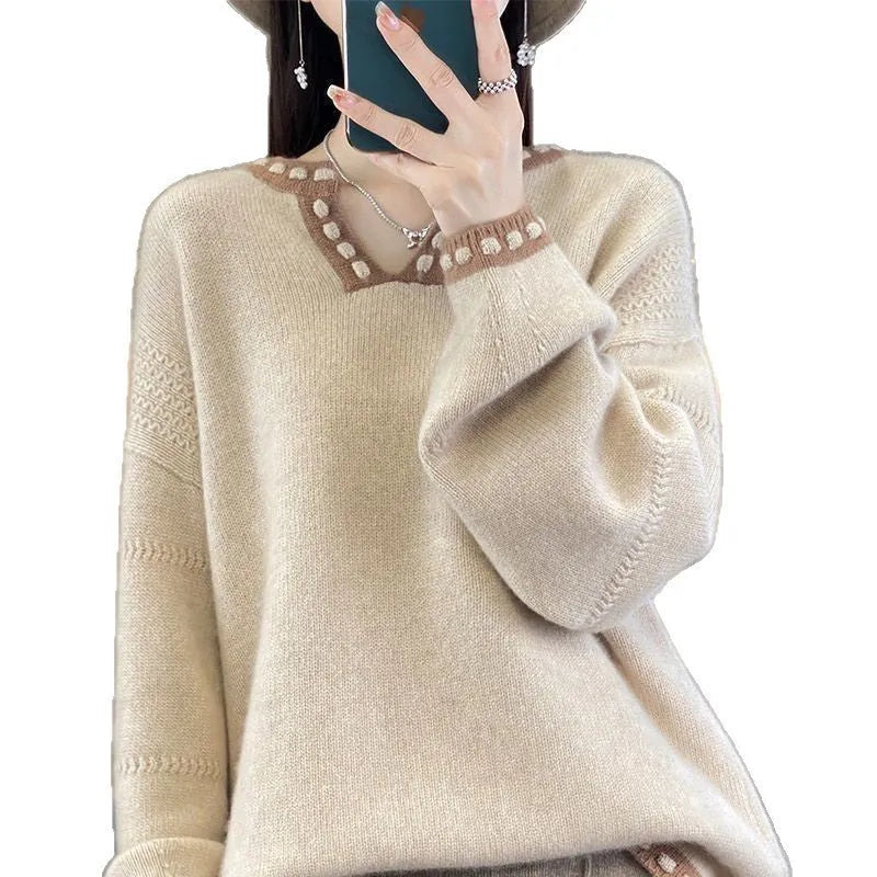 Women's white V-neck long sleeve viscose sweater on a hanger.