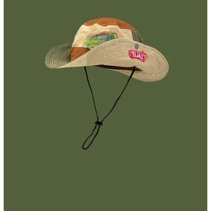 Army green cotton foldable fisherman hat with flat top crown and retro patchwork details.