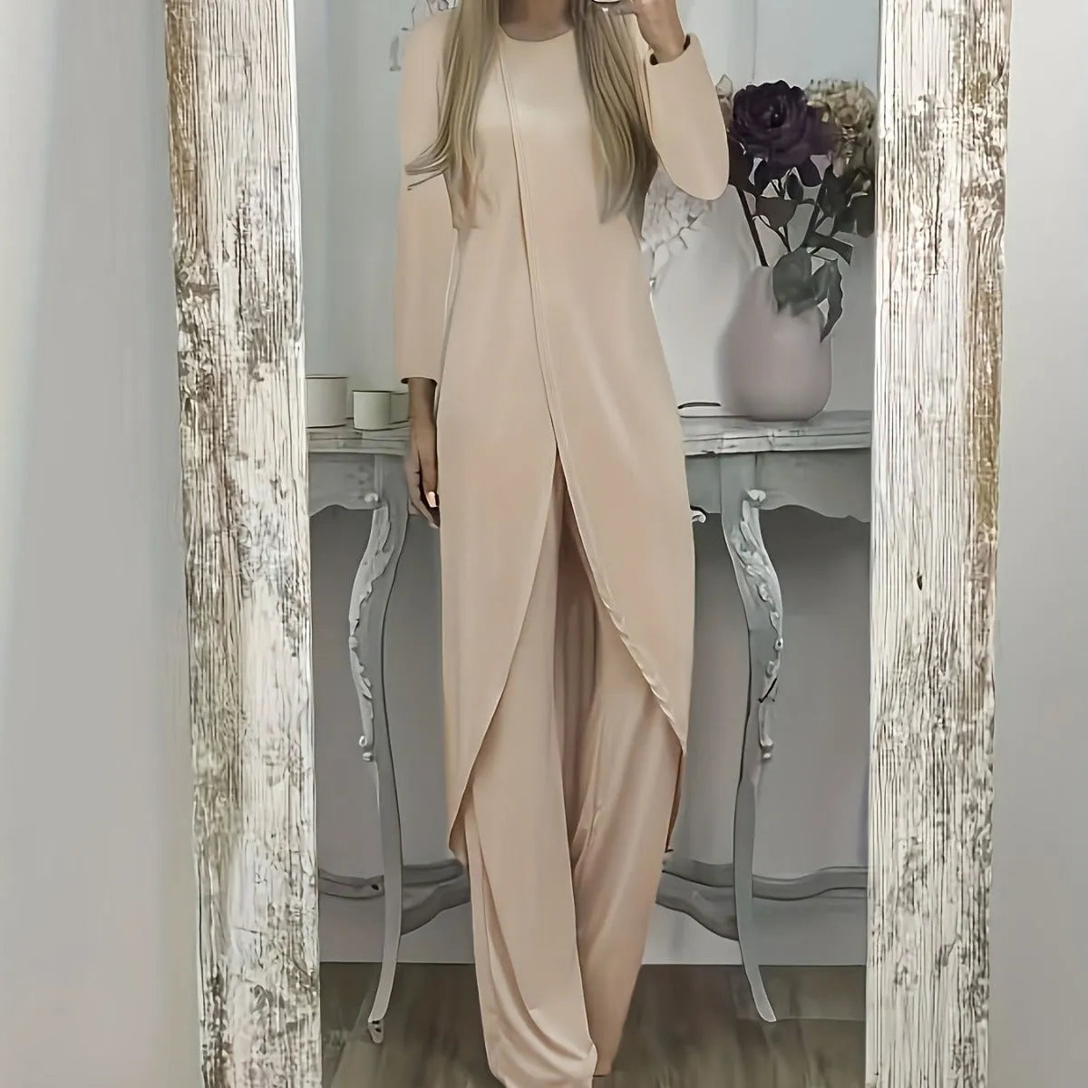Women's black casual two-piece lounge set with long sleeves and matching trousers on a hanger