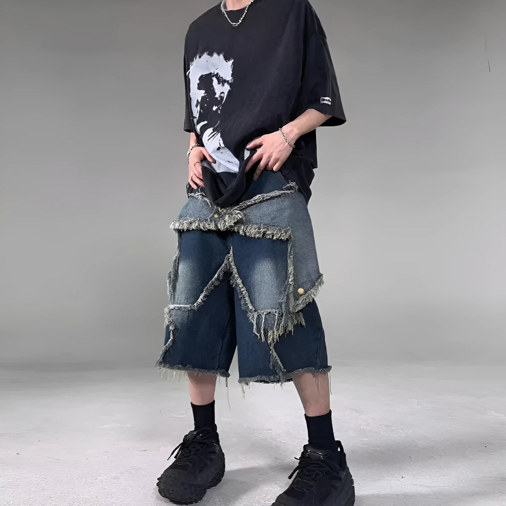 Blue denim shorts with frayed hem and five-pointed star detail, loose fit silhouette