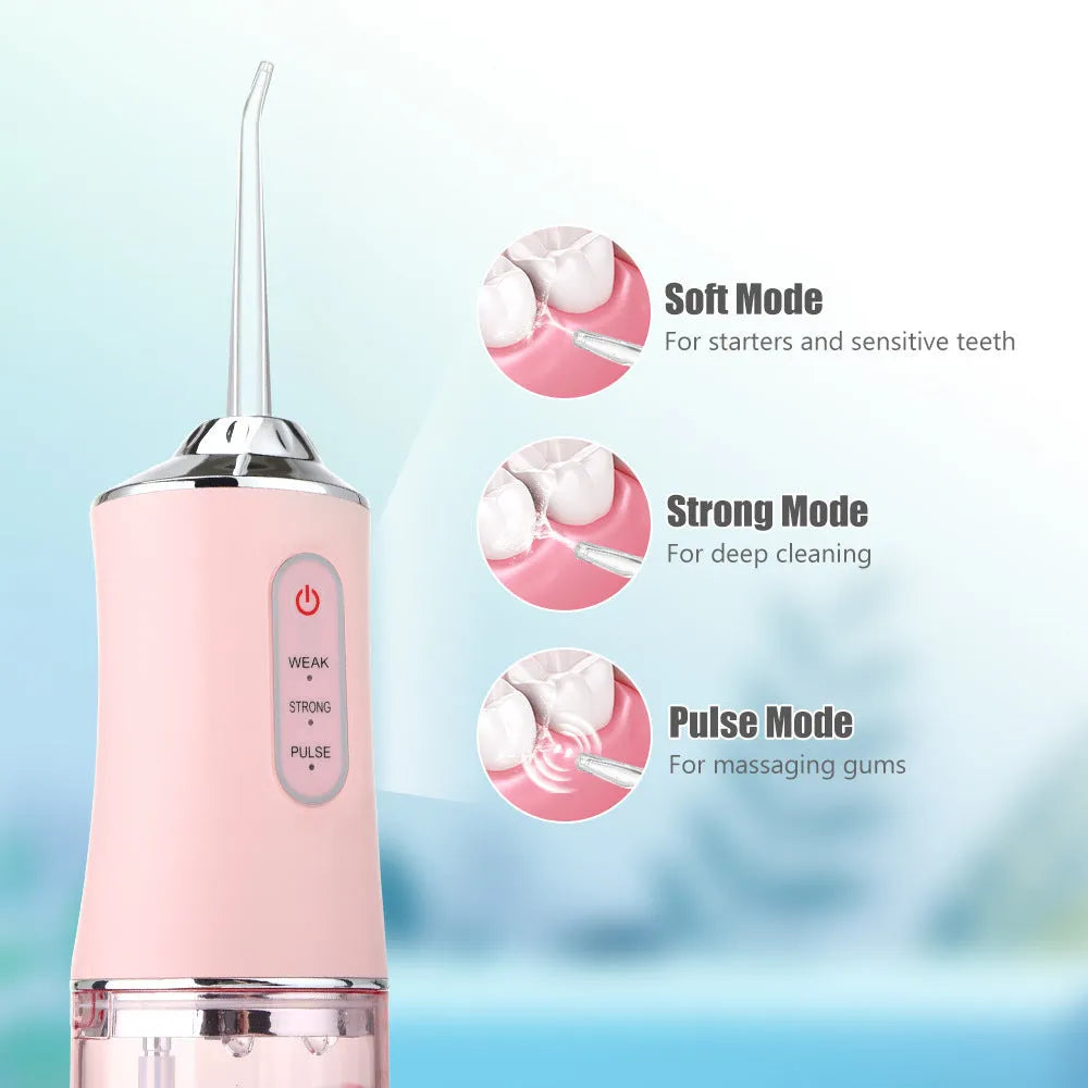Handheld electric water flosser in white, pink, light green, or white-green with three speed settings, four nozzles, and USB cable