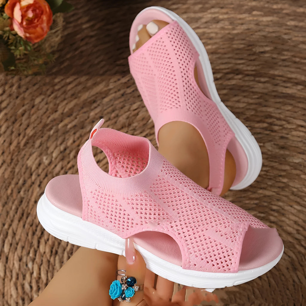 Women's beige platform sports sandals with a flat toe and rubber sole.