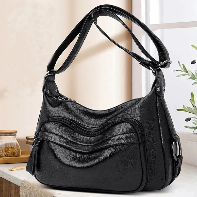 Large black or blue soft PU women's shoulder bag with crossbody strap and multiple internal pockets