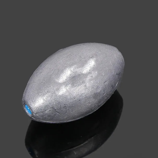 Tongxin olive-shaped lead fishing sinker with scale markings, showing rugby shape and plastic core construction.