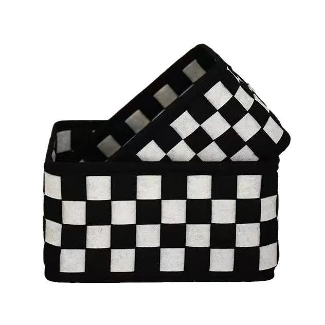 Checkerboard patterned foldable felt storage basket showing its box shape and textured sides.