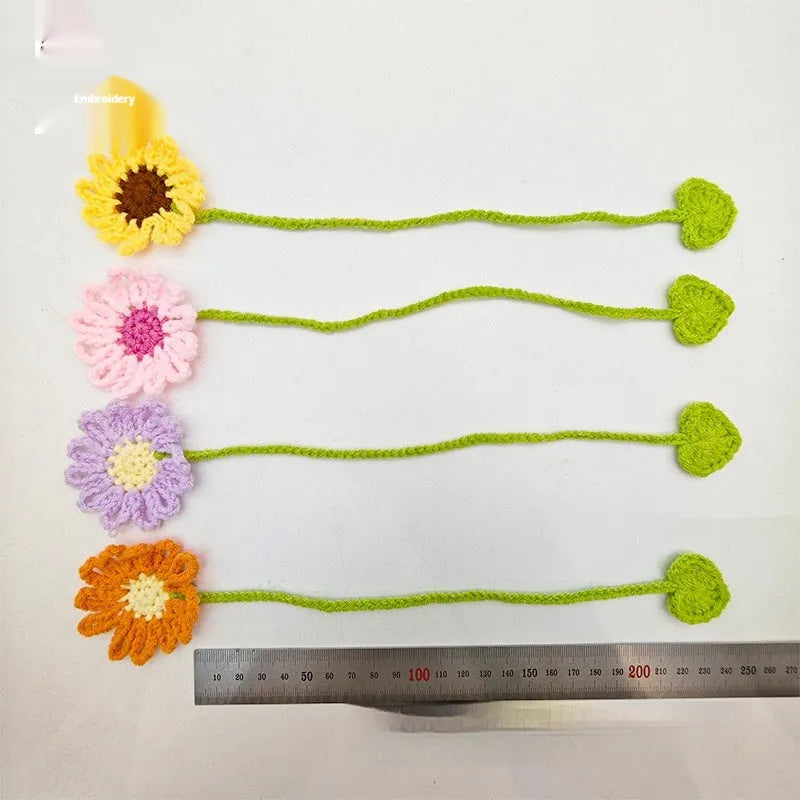 Hand-crocheted wool bookmark with daisy motifs on flexible wire in multiple colour options