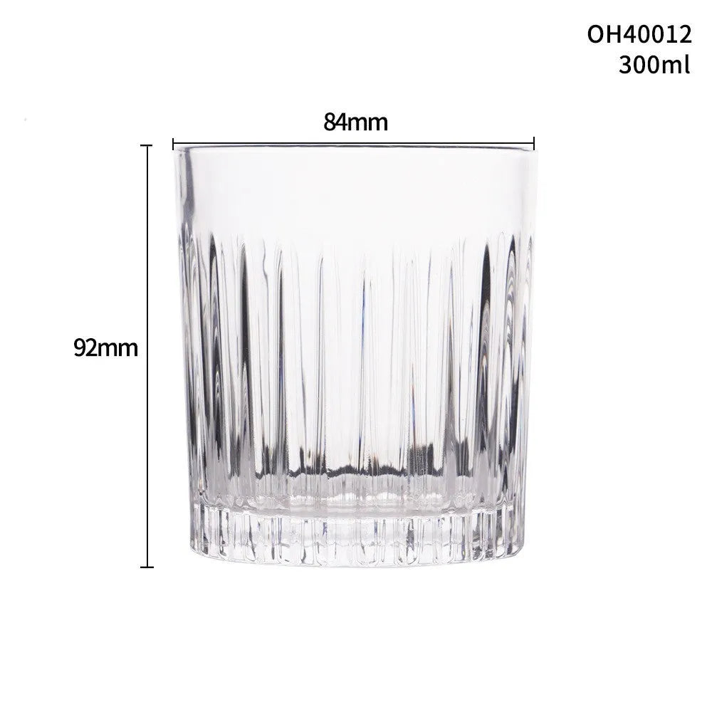 Thick bottom crystal whiskey shot glass with 350ml capacity on a table.